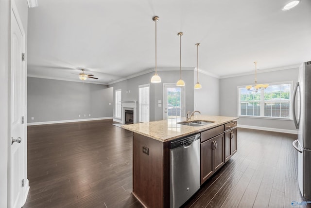 506 Foxridge Dr SW, Hartselle, AL 35640 - kitchen with ceiling fan with notable chandelier, dark brown cabinets, baseboards, a sink, and appliances with stainless steel finishes