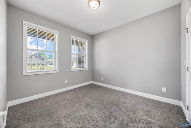 506 Foxridge Dr SW, Hartselle, AL 35640 - unfurnished room with baseboards and carpet flooring