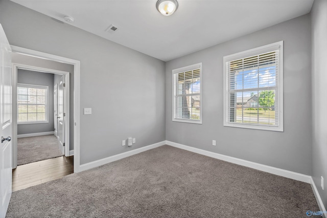 506 Foxridge Dr SW, Hartselle, AL 35640 - carpeted spare room featuring baseboards and a healthy amount of sunlight