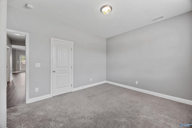 506 Foxridge Dr SW, Hartselle, AL 35640 - empty room with carpet floors, baseboards, and visible vents