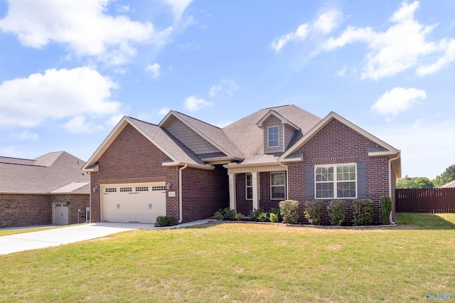 506 Foxridge Dr SW, Hartselle, AL 35640 - craftsman inspired home featuring a garage, a front lawn, fence, brick siding, and concrete driveway