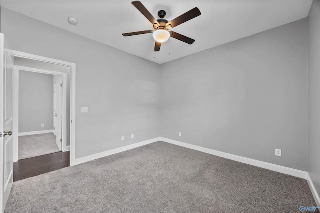 506 Foxridge Dr SW, Hartselle, AL 35640 - spare room with dark colored carpet, a ceiling fan, and baseboards