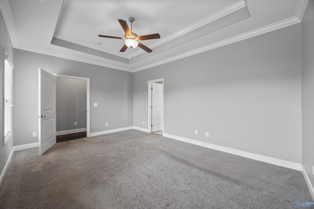 506 Foxridge Dr SW, Hartselle, AL 35640 - unfurnished bedroom featuring baseboards, ornamental molding, carpet, and a tray ceiling