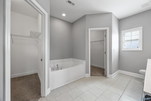 506 Foxridge Dr SW, Hartselle, AL 35640 - full bathroom featuring visible vents, baseboards, a bath, and toilet