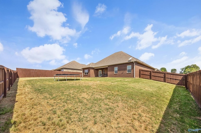 506 Foxridge Dr SW, Hartselle, AL 35640 - view of yard with a fenced backyard and a trampoline