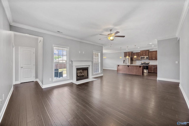 506 Foxridge Dr SW, Hartselle, AL 35640 - unfurnished living room featuring a high end fireplace, baseboards, a ceiling fan, and dark wood-style floors