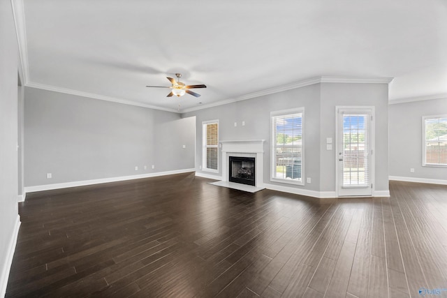 506 Foxridge Dr SW, Hartselle, AL 35640 - unfurnished living room with ornamental molding, a fireplace with flush hearth, baseboards, a ceiling fan, and dark wood finished floors