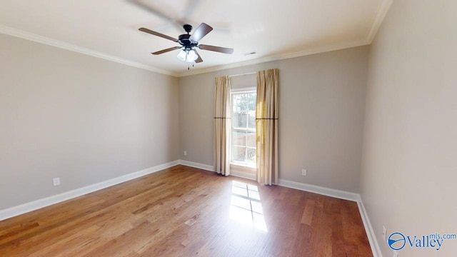 spare room with ceiling fan, hardwood / wood-style flooring, and crown molding