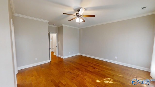 spare room featuring ornamental molding, wood-type flooring, and ceiling fan