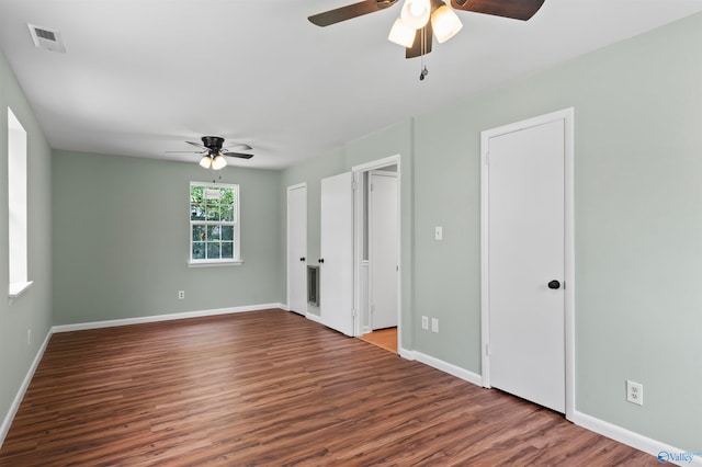 empty room with ceiling fan and hardwood / wood-style flooring