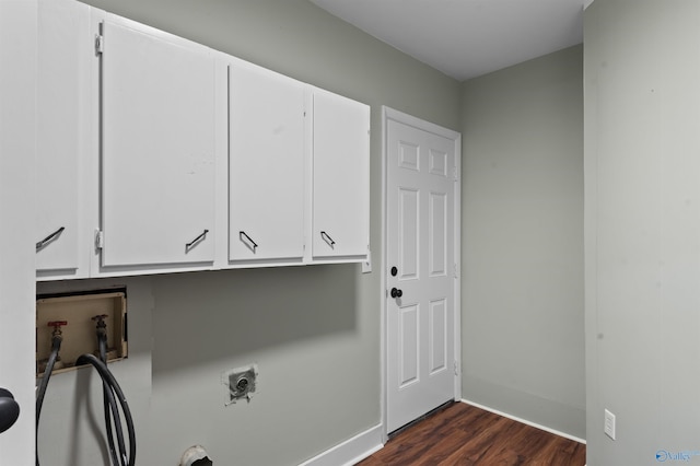 laundry area with hookup for an electric dryer, washer hookup, baseboards, cabinet space, and dark wood-style floors