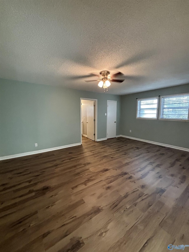 175 County Road 371, Centre, AL 35960 - unfurnished room featuring dark wood finished floors, a textured ceiling, baseboards, and ceiling fan
