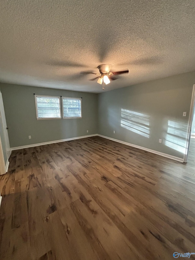 175 County Road 371, Centre, AL 35960 - spare room with dark wood-style flooring, ceiling fan, a textured ceiling, and baseboards