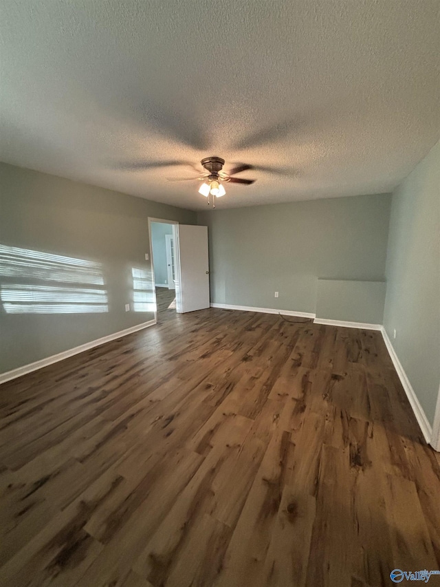 175 County Road 371, Centre, AL 35960 - unfurnished room featuring dark wood-style floors, a textured ceiling, a ceiling fan, and baseboards