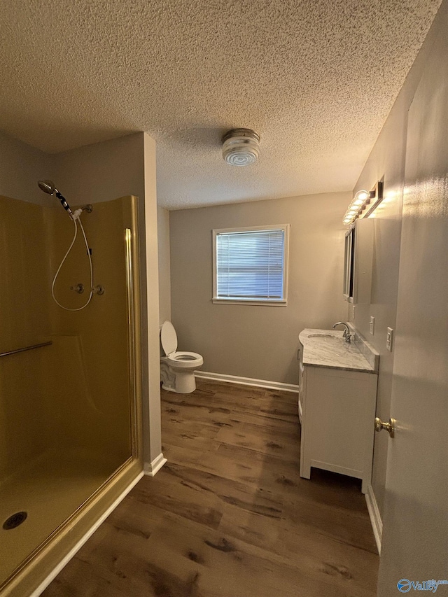 175 County Road 371, Centre, AL 35960 - bathroom with toilet, wood finished floors, vanity, walk in shower, and a textured ceiling