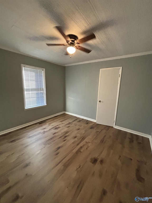 175 County Road 371, Centre, AL 35960 - unfurnished room with crown molding, a ceiling fan, dark wood finished floors, and baseboards