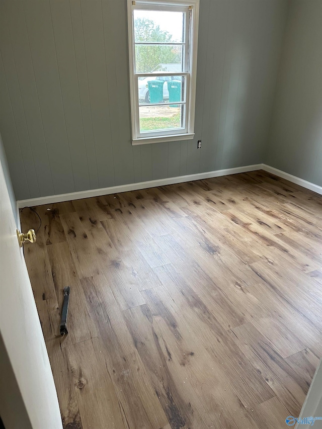 unfurnished room with light hardwood / wood-style flooring