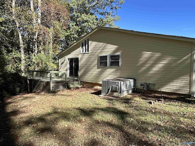 175 County Road 371, Centre, AL 35960 - rear view of property featuring central air condition unit, a deck, and a yard