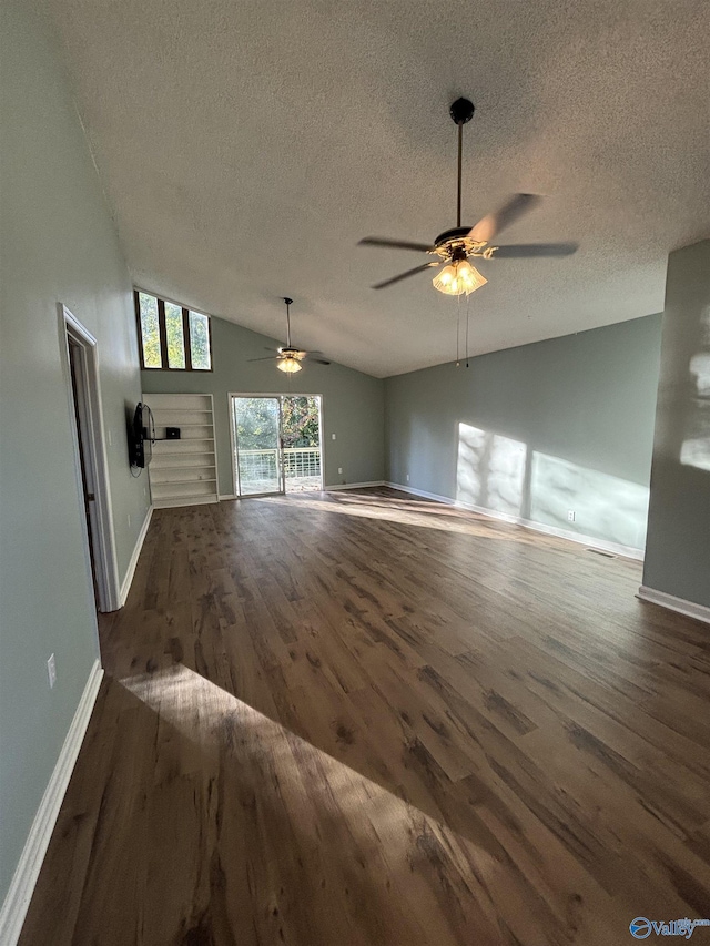 175 County Road 371, Centre, AL 35960 - unfurnished living room with lofted ceiling, wood finished floors, ceiling fan, a textured ceiling, and baseboards