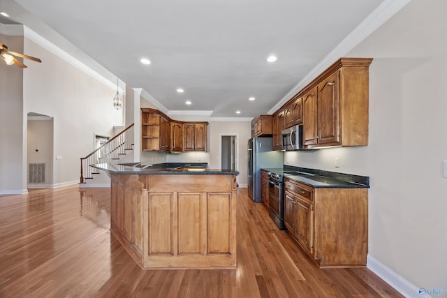 kitchen with electric stove, dark countertops, stainless steel microwave, a peninsula, and open shelves