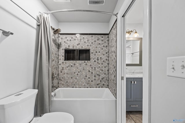 full bath with visible vents, shower / tub combo with curtain, vanity, and toilet