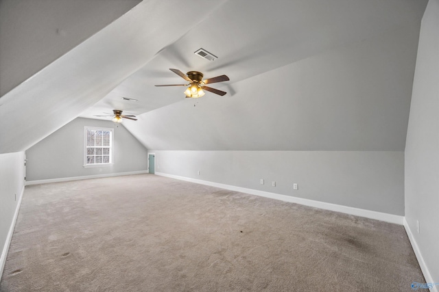 bonus room with lofted ceiling, carpet, visible vents, and baseboards