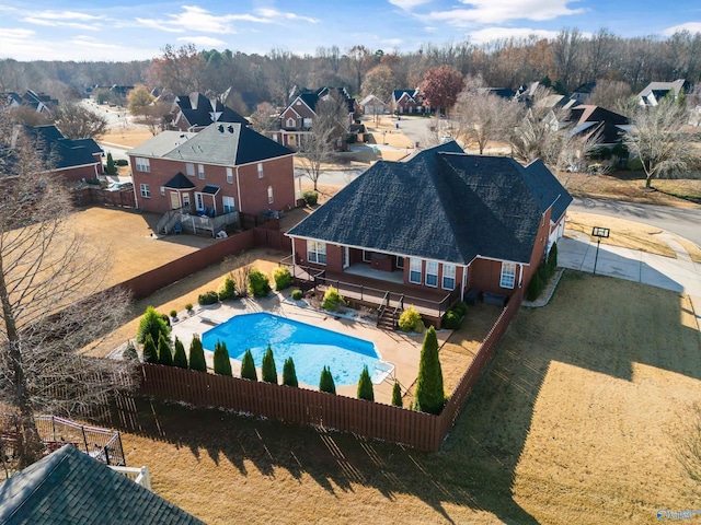 view of swimming pool with a patio, a fenced backyard, a residential view, and a fenced in pool