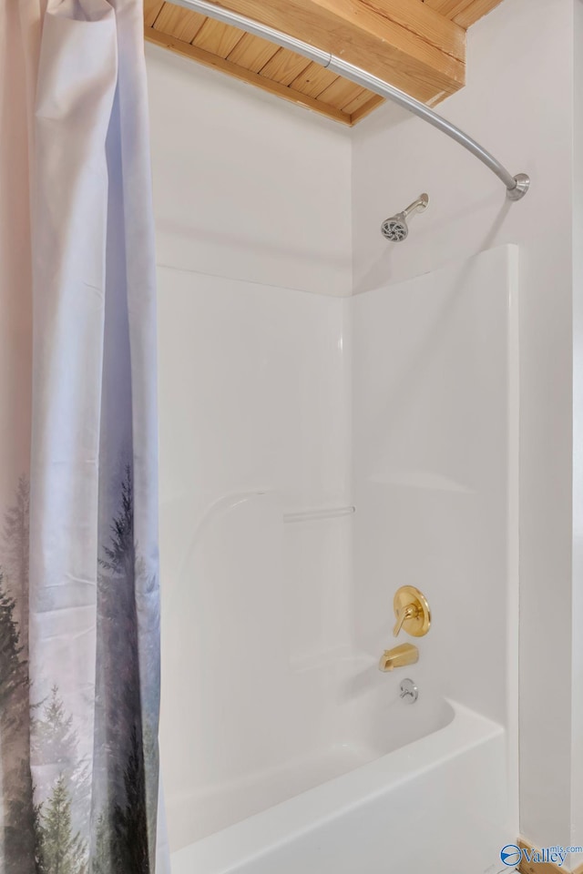 bathroom featuring shower / bathtub combination with curtain