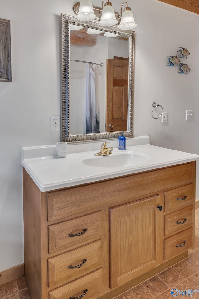 bathroom with a shower with shower curtain and vanity