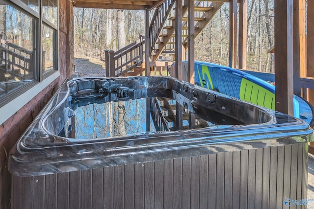 exterior space featuring a wooded view and stairs