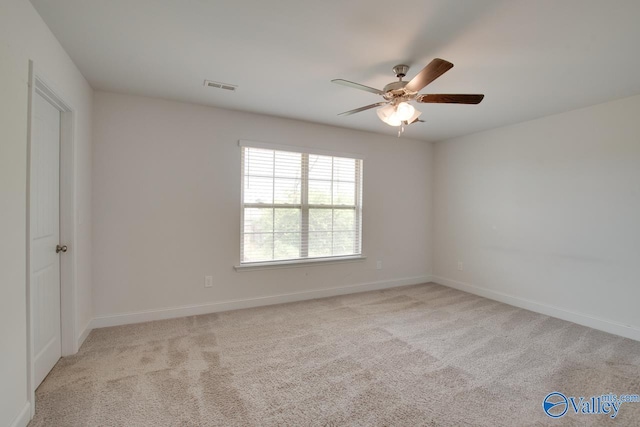 214 Tybee Dr, Madison, AL 35756 - spare room featuring carpet floors, a ceiling fan, baseboards, and visible vents
