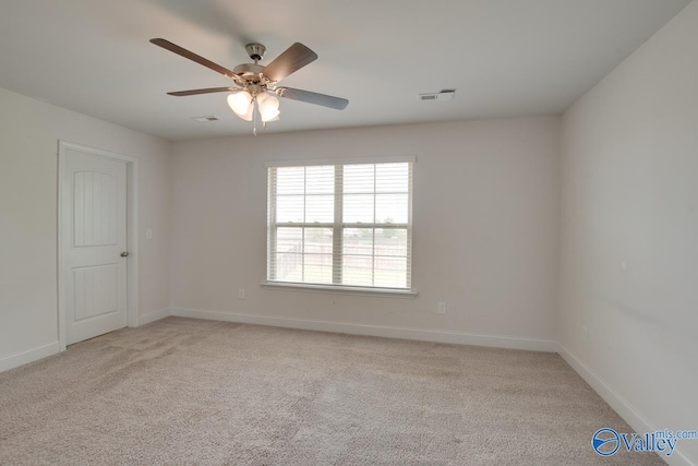214 Tybee Dr, Madison, AL 35756 - empty room with visible vents, a ceiling fan, baseboards, and light colored carpet
