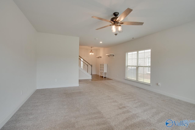 214 Tybee Dr, Madison, AL 35756 - unfurnished room with stairs, carpet flooring, ceiling fan, and baseboards
