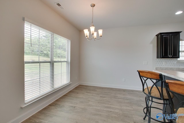 214 Tybee Dr, Madison, AL 35756 - unfurnished dining area featuring baseboards, an inviting chandelier, and visible vents