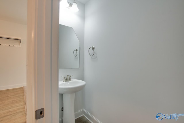 214 Tybee Dr, Madison, AL 35756 - bathroom with baseboards and wood finished floors