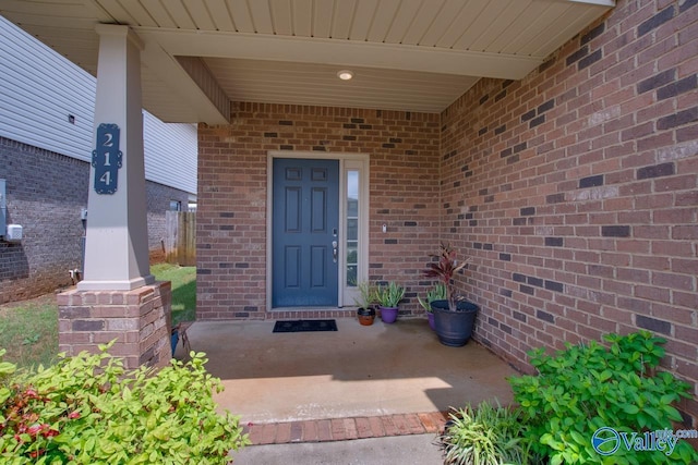 214 Tybee Dr, Madison, AL 35756 - property entrance with brick siding and a porch