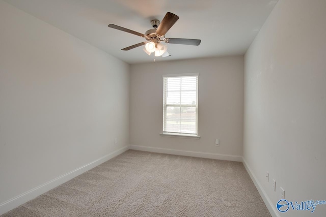 214 Tybee Dr, Madison, AL 35756 - empty room featuring a ceiling fan, baseboards, and light carpet