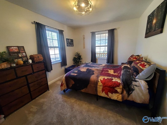 bedroom featuring dark carpet