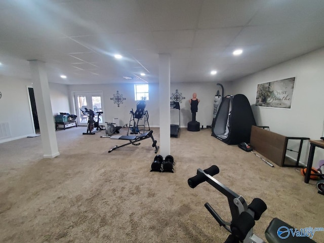 workout area with light carpet and a drop ceiling