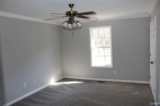 unfurnished room featuring ornamental molding, carpet, and baseboards