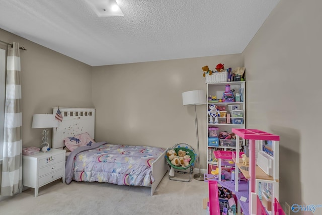 carpeted bedroom with a textured ceiling