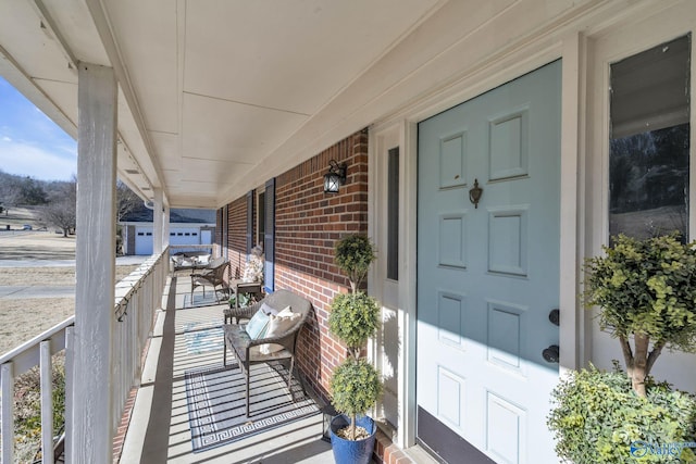 doorway to property featuring covered porch