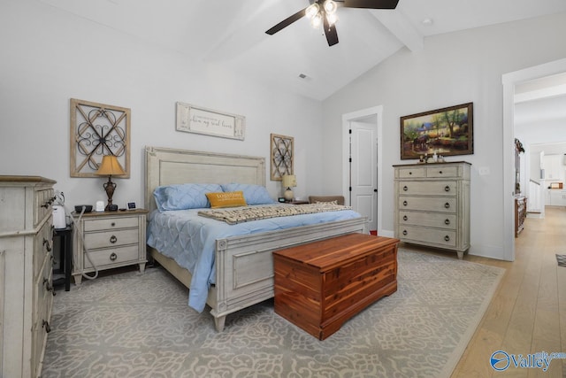 bedroom featuring lofted ceiling with beams, ceiling fan, and light hardwood / wood-style flooring