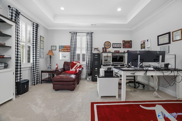 carpeted home office featuring a tray ceiling and ornamental molding