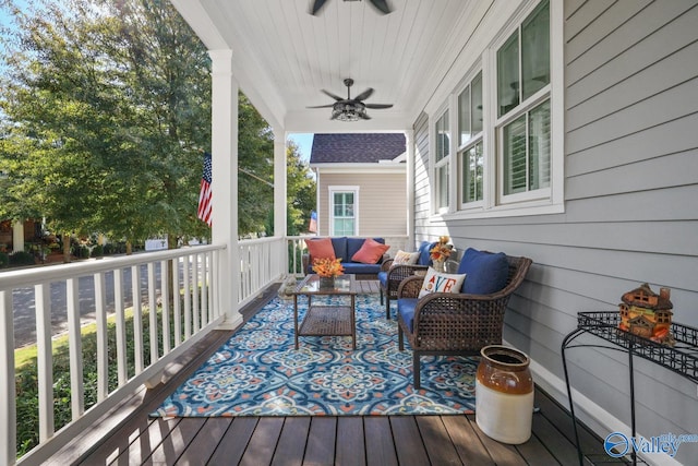 wooden deck with ceiling fan and an outdoor living space