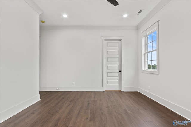 spare room featuring ceiling fan and dark hardwood / wood-style flooring