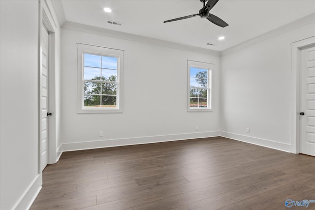 unfurnished bedroom with multiple windows, crown molding, dark wood-type flooring, and ceiling fan