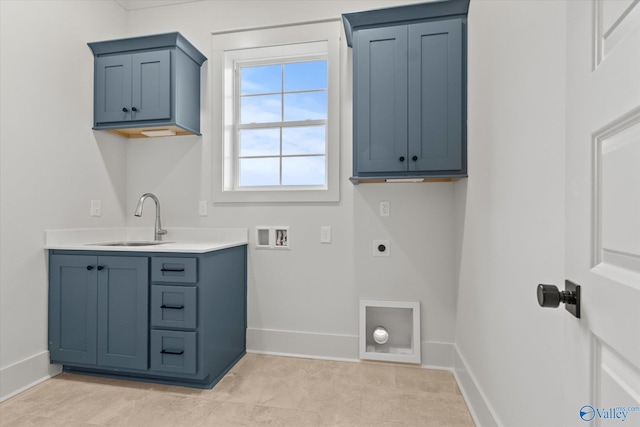 laundry area with cabinets, hookup for an electric dryer, hookup for a washing machine, and sink