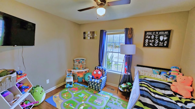 403 E Charlotte Ave, Scottsboro, AL 35768 - bedroom with baseboards, visible vents, multiple windows, and wood finished floors
