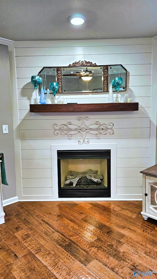 403 E Charlotte Ave, Scottsboro, AL 35768 - interior details featuring a large fireplace and wood finished floors